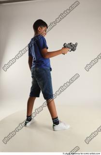 TIMBO STANDING POSE WITH GUN